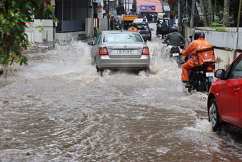  Vehicles are plying on the Pipinemood-Kowdiar road, which was flooded due to sudden heavy rain in Thiruvananthapuram