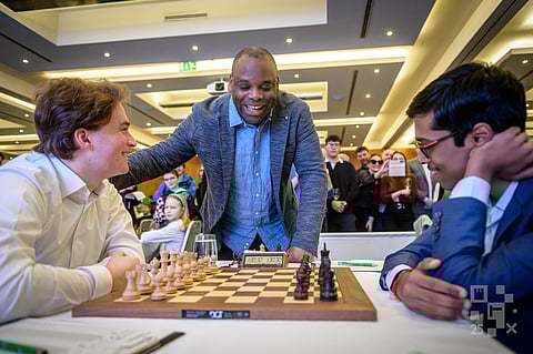 Grandmaster R Praggnanandhaa (R) and Vincent Keymer of Germany before the start of their game at the Prague Masters 