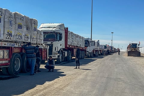 Trucks line up at the Egyptian side of the Rafah border crossing between Egypt and the Gaza Strip after Israel blocked the entry of aid trucks into Gaza, Sunday, March 2, 2025. 