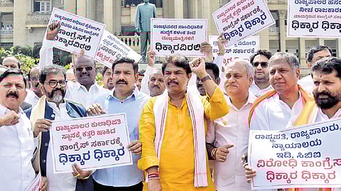 BJP state president BY Vijayendra, LoP R Ashoka and senior legislators protest against the Congress government at Vidhana Soudha on Monday.
