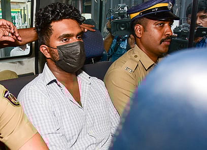  Afan, the accused in the Venjaramoodu mass murder case, being escorted to Poojappura Central jail. 