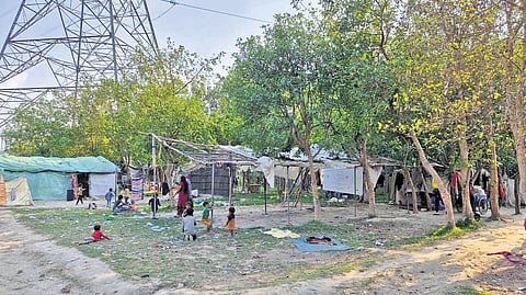 Residents along Yamuna Khadar in Shastri Park on Tuesday.