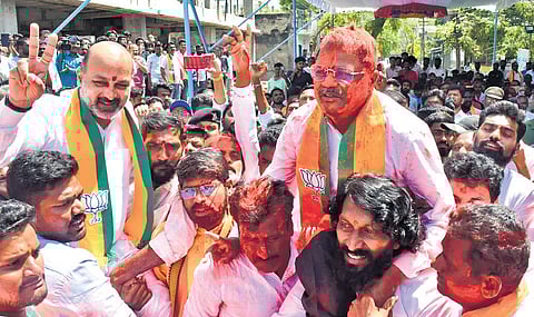 Union Minister of State for Home Affairs Bandi Sanjay Kumar celebrates with the teachers’ segment MLC election winner Malka Komuraiah in Karimnagar