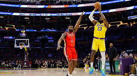 LeBron James shoots a 3-point basket to score his 50,002 NBA regular season and playoff career points during the first half New Orleans Pelicans at Crypto.com Arena on March 04, 2025 in Los Angeles, California.