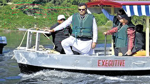 Delhi Minister Parvesh Sahib Singh Verma takes a boat ride during inspection of the cleanliness efforts at Yamuna ghats, in New Delhi on March 5, 2025.