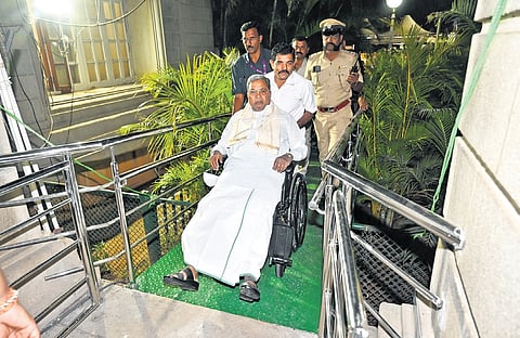 Chief Minister Siddaramaiah being wheeled in to attend the cabinet meeting at Vidhana Soudha in Bengaluru on Wednesday 