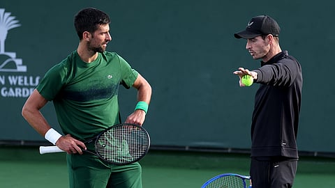 Novak Djokovic of Serbia and his coach Andy Murray working on his serve during a practice session at the BNP Paribas Open at Indian Wells Tennis Garden on March 06, 2025 in Indian Wells, California.
