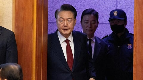 In this photo from Feb. 13, 2025, South Korea's impeached President Yoon Suk Yeol, top left, attends a hearing of his impeachment trial at a Constitutional Court in Seoul.