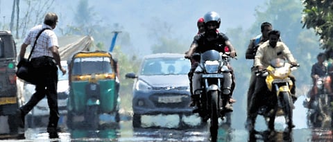 Mirages appear on a sunny afternoon at the Seed Access Road