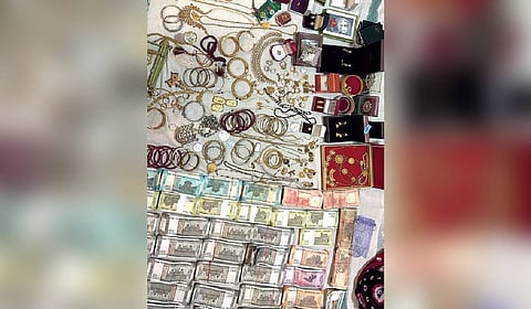 Three gold biscuits and gold ornaments of about 1.5 kg, Rs 15.55 lakh cash were recovered.