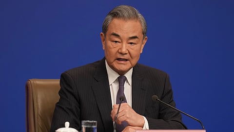 Chinese Foreign Minister Wang Yi speaks during a press conference on the sidelines of the National People's Congress in Beijing, Friday, March 7, 2025.