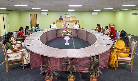 In this image provided by PMO on March 8, 2025, Prime Minister Narendra Modi during interaction with 'Lakhpati Didis', in Navsari, Gujarat. Gujarat CM Bhupendra Patel is also seen.