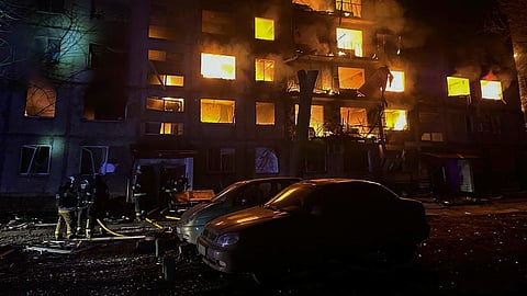In this photo provided by the Ukrainian Emergency Service, firefighters put out the fire following a Russian rocket attack in Dobropillya, Donetsk region, Ukraine, Saturday, March 8, 2025.