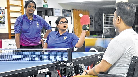 Meenakshi giving classes to a wheelchair user at Ganga Spine Rehab Centre