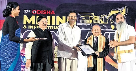 Governor Hari Babu Kambhampati distributing awards at Odisha Mining and Infrastructure International Expo at Bhubaneswar on Sunday