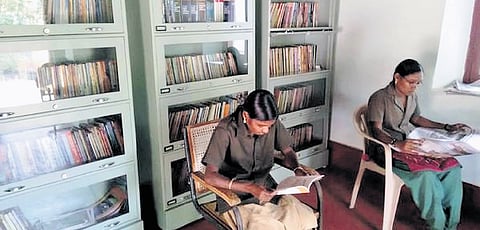 Tribal women of Chinnar Wildlife Sanctuary reading books at the Bodhi library