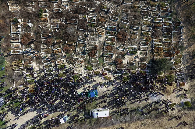 Relatives and neighbours attend the funeral procession for four Syrian security force members killed in clashes with loyalists of ousted President Bashar Assad in coastal Syria, in the village of Al-Janoudiya, west of Idlib, Saturday, March 8, 2025. 