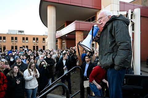 Sen. Bernie Sanders, I-Vt., right, speaks to an overflow crowd outside Lincoln High School as he talks about "Fighting Oligarchy: Where We Go From Here", Saturday, March 8, 2025, in Warren, Mich.