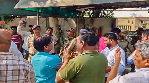 Gathering during raids by the Enforcement Directorate (ED) on premises linked to Chaitanya Baghel, son of former Chhattisgarh Chief Minister and Congress leader Bhupesh Baghel, in connection with an alleged liquor scam, in Bhilai, Monday, March 10, 2025. 