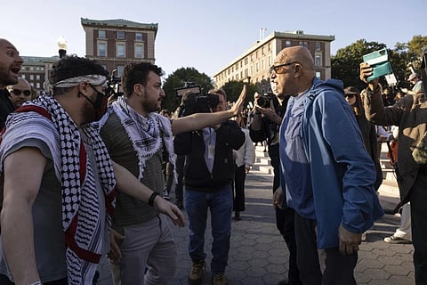 Pro-Palestinian demonstrator Mahmoud Khalil, second from left, debates with a pro-Israel demonstrator during a protest at Columbia University, Thursday, October. 12, 2023, in New York.