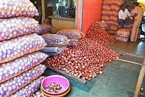 As many as 15 farmers climbed atop a water tank to protest the drop in prices of onion and also stalled its auctions for sometime on Monday.