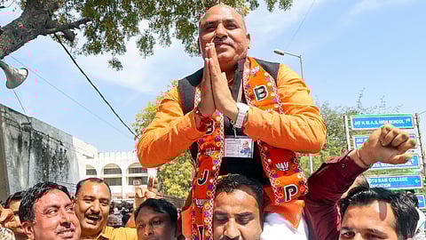 BJP candidate from Rohtak Municipal Corporation Ram Avtar Valmiki celebrates after winning the election, in Rohtak, Wednesday, March 12, 2025.