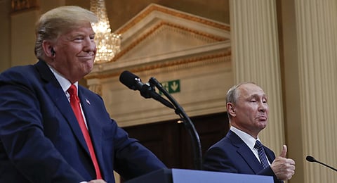In this photo from July 16, 2018, Russian President Vladimir Putin, right, and US President Donald Trump give a joint news conference at the Presidential Palace in Helsinki, Finland.