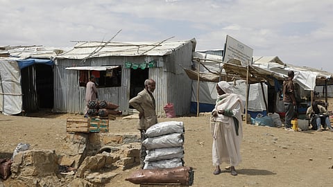 Internally displaced people walk through the Sebacare camp on the outskirts of Mekele, Tigray region, Ethiopia, Wednesday, Feb. 12, 2025.