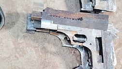 The illegal firearms seized from the accused 