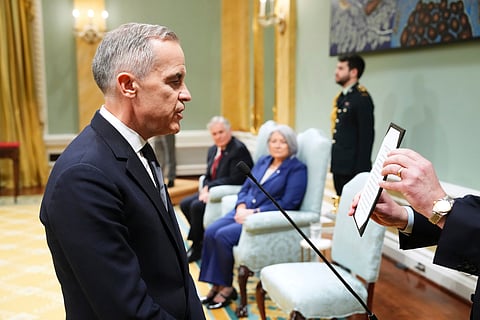 Canada's Prime Minister Mark Carney (L) and President Donald Trump