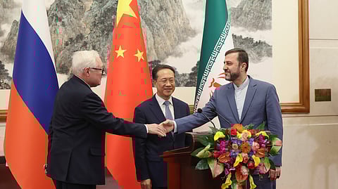 From left, Russian Deputy Foreign Minister Sergei Ryabkov, Chinese Vice Foreign Minister Ma Zhaoxu and Iranian Deputy Foreign Minister Kazem Gharibabadi, meet with reporters after their meeting at Diaoyutai State Guest House on March 14, 2025 in Beijing, China.