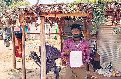 A bewildered J Venkateswarlu shows the notice demanding Rs 22,86,014 GST