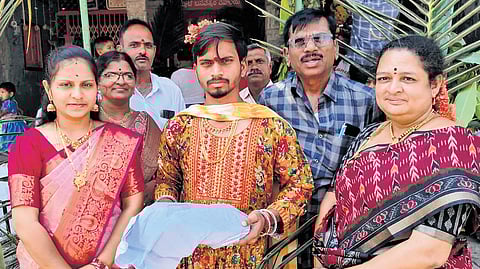 Men in the attire of women going to Rati Manmadha temple at Santhekudlur in Kurnool district on Friday.