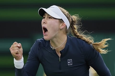 Mirra Andreeva of Russia, celebrates winning a point against Iga Swiatek of Poland, during the semifinals at the BNP Paribas Open tennis tournament Friday, March 14, 2025, in Indian Wells, Calif.