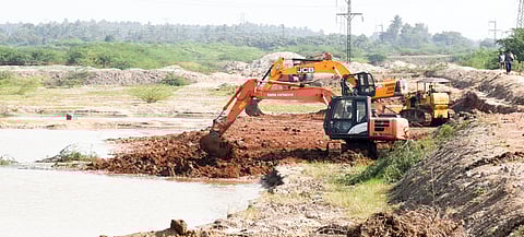 A file pic of desilting works being undertaken in an irrigation channel.