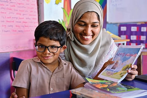 Ameen K N with his class teacher Sakkeera Banu