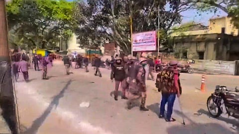 Security personnel deployed to maintain law and order after some children allegedly threw stones at 'Laat Sahab' procession, in Shahjahanpur, Uttar Pradesh, Friday, March 14, 2025. 