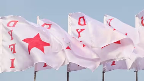 The board also directed its vigilance wing to probe the events leading to the rendering of songs glorifying CPM and the alleged display of DYFI flags in the background screen.