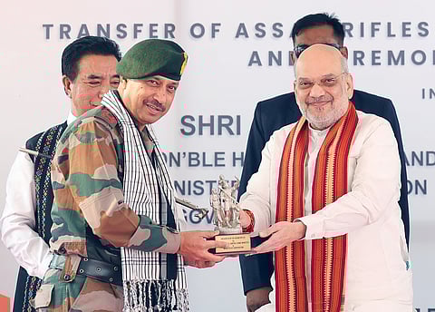  Union Home Minister Amit Shah being felicitated by Director General, Assam Rifles, Lieutenant General Vikas Lakhera during the land transfer ceremony held between the Assam Rifles and Govt of Mizoram, in Aizawl on Saturday. 