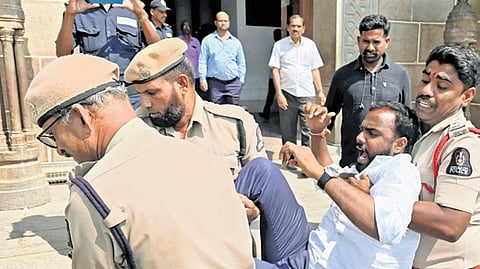 Cops detain ABVP activists for staging a protest at Osmania Arts College.