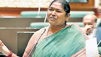 Minister Dansari Anasuya smiles as she speaks during the ongoing session of the state Assembly on Monday.