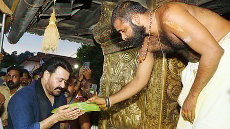 Actor Mohanlal offering prayers at Sabarimala temple