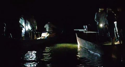 Multiple teams are carrying out the rescue operations with torches and tractor lights.