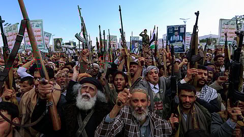 Yemenis brandish rifles and chant during a demonstration called for by the rebel Huthi movement in Sanaa on March 17, 2025. Huge crowds joined protests in rebel-controlled Yemen on March 17 after deadly US strikes killed dozens and sparked fears of a new cycle of violence in the conflict-torn country.