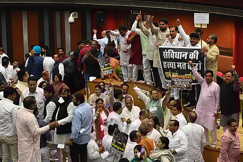 BJP and AAP Delhis Ward Councillors create ruckus during the house meeting of the Municipal Corporation of Delhi in New Delhi on Monday.