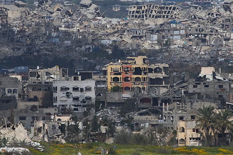 A view of destroyed buildings by Israeli bombardments in the northern Gaza Strip as seen from southern Israel, Wednesday, March 19, 2025.