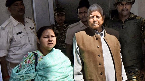 RJD chief Lalu Yadav and his daughter Misa Bharti arrive to appear before the Enforcement Directorate in connection with the land-for-jobs money laundering case in Patna on Wednesday, March 19, 2025.
