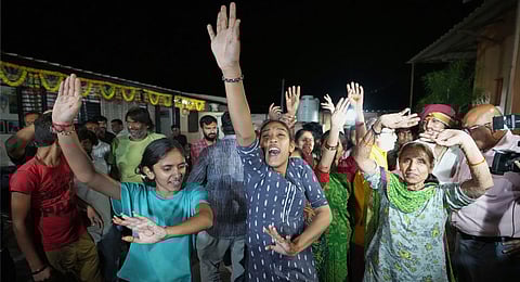 Villagers dance as they celebrate the safe return of NASA astronaut Suni Williams from the International Space Station (ISS), at a temple in her ancestral village Jhulasan in Mehsana district of Gujarat state, India, Wednesday, March 19, 2025. 