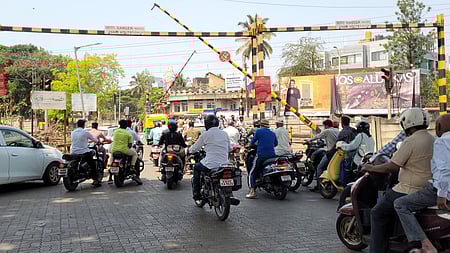 Students appearing for the Class 10 government public examinations, the level crossing at railway gate.
