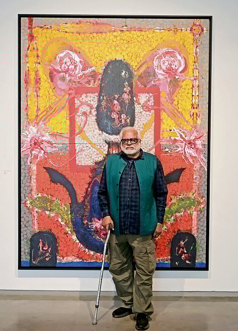Manu’s Parekh in front of one of his paintings